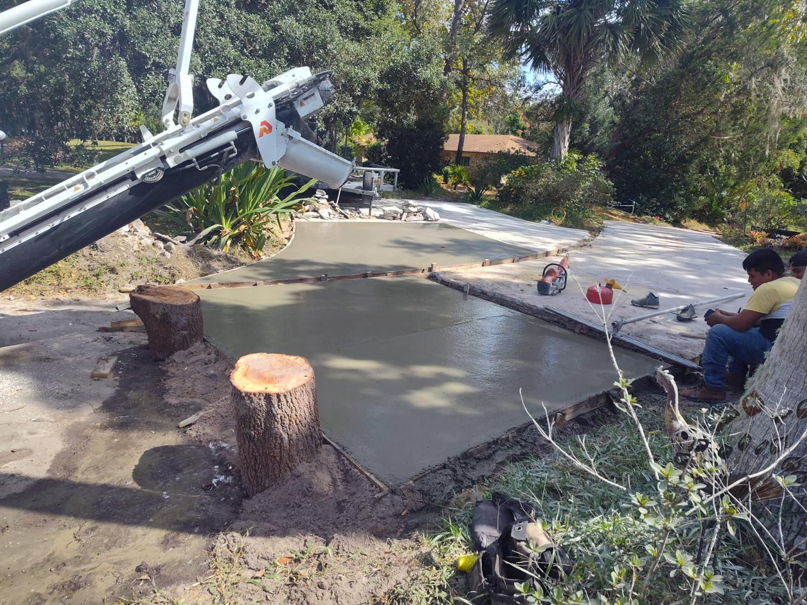 Concrete driveway installation with pump truck in Apopka by FB Solutions